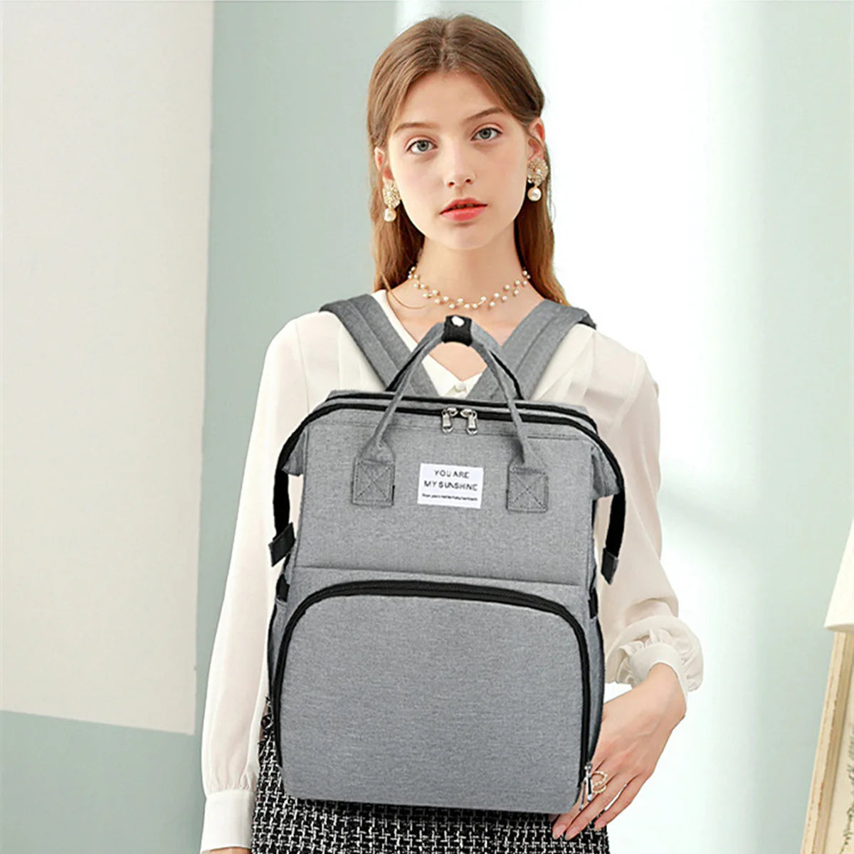 Portable folding crib, mommy bag, multi-functional, light and large-capacity leisure, double shoulder mother and baby bag.