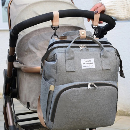 Portable folding crib, mommy bag, multi-functional, light and large-capacity leisure, double shoulder mother and baby bag.