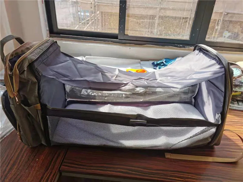 Portable folding crib, mommy bag, multi-functional, light and large-capacity leisure, double shoulder mother and baby bag.