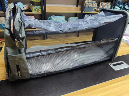 Portable folding crib, mommy bag, multi-functional, light and large-capacity leisure, double shoulder mother and baby bag.