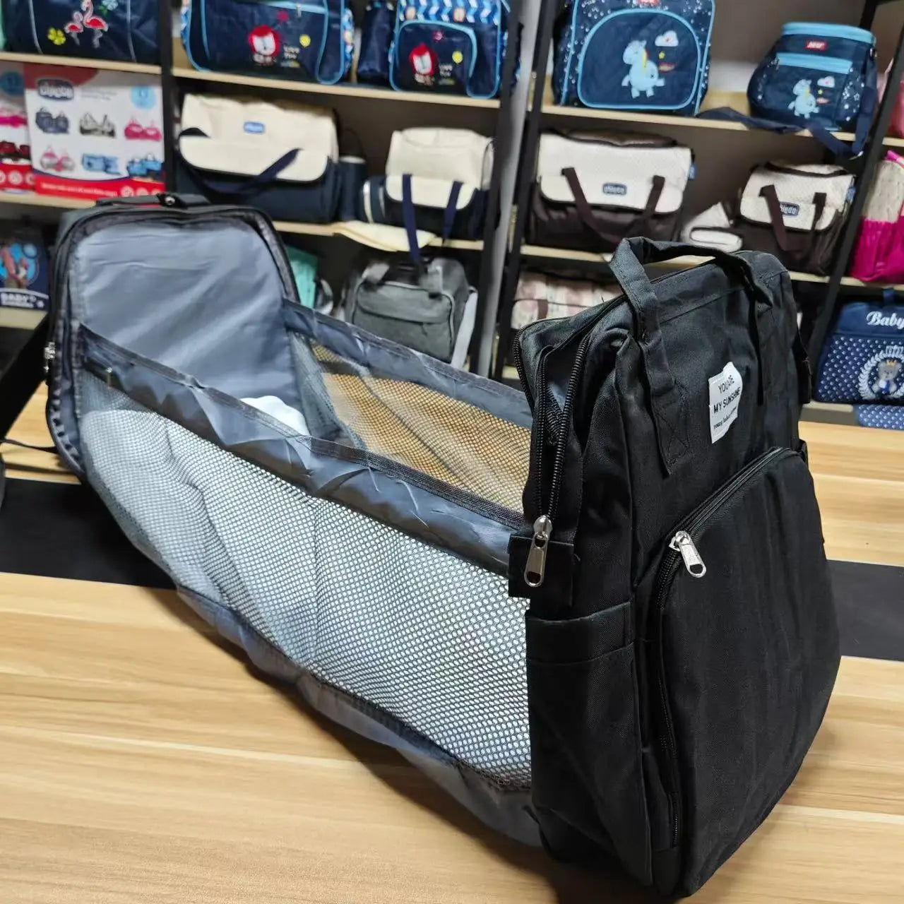 Portable folding crib, mommy bag, multi-functional, light and large-capacity leisure, double shoulder mother and baby bag.